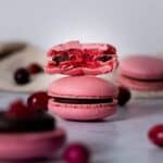Chocolate cranberry macarons with a bite