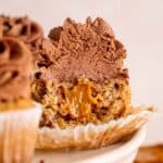 Half of a banoffee cupcake showing the dulce de leche on the inside.