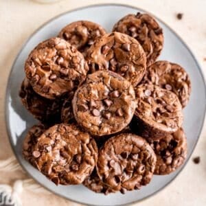 Mini brownie bites on a plate.