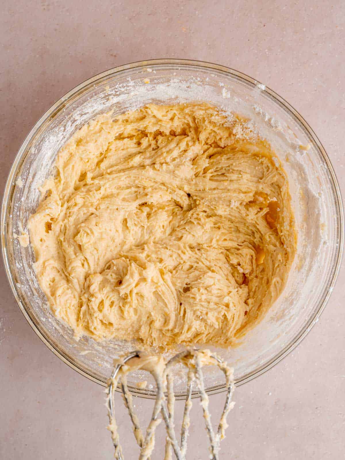 Lemon muffin batter mixed in a bowl.