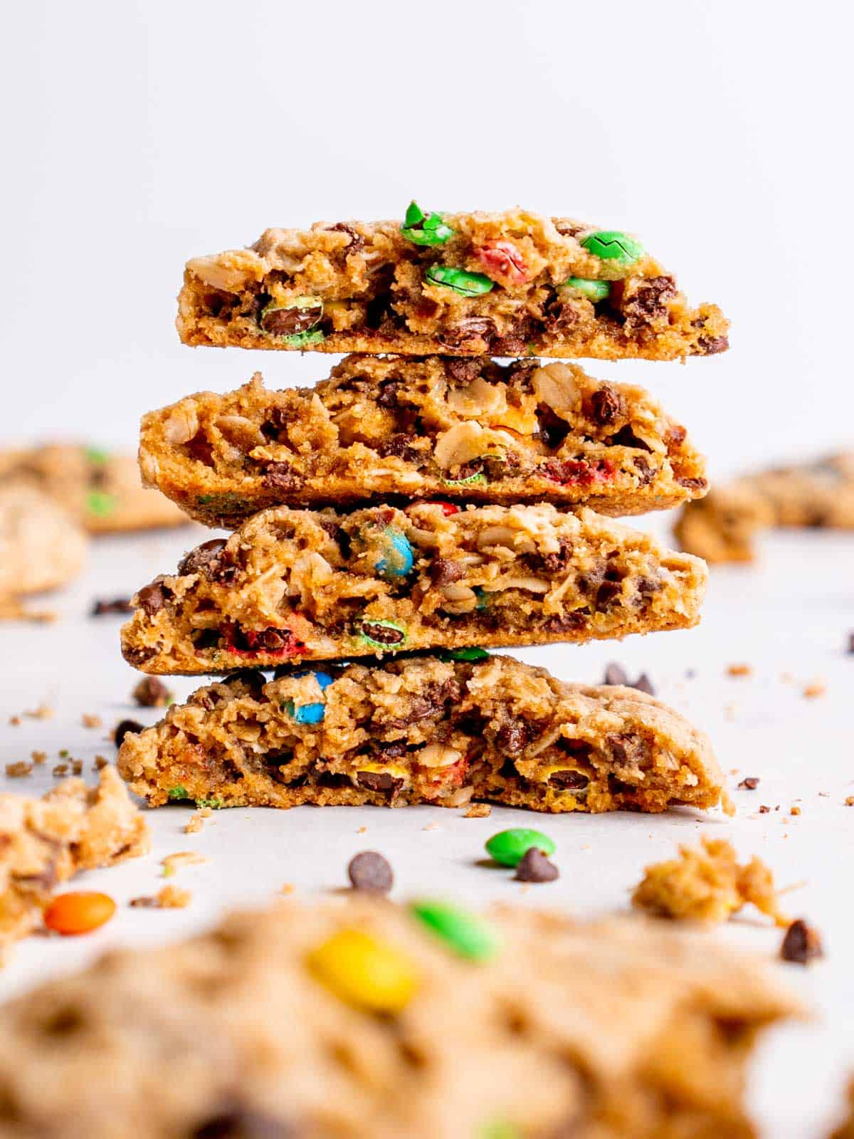 a stack of monster cookies cut in half