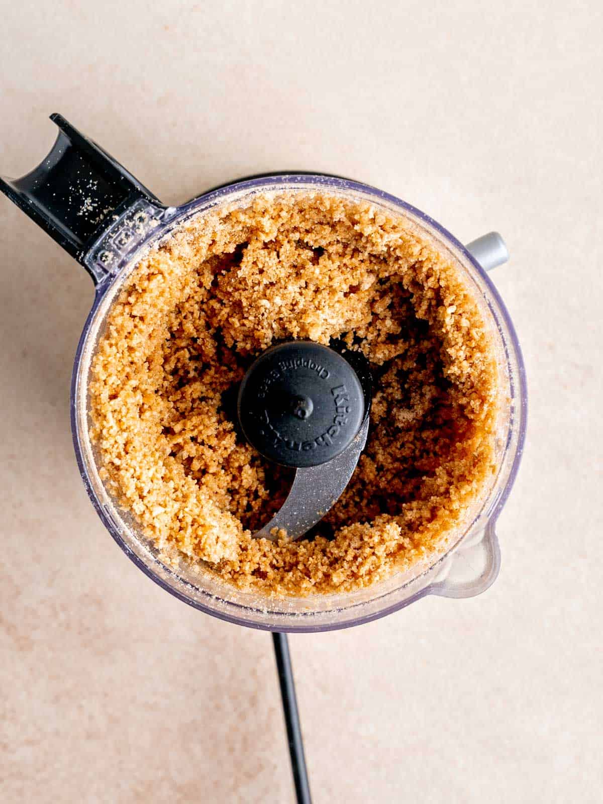 Graham cracker crumbs in a food processor.