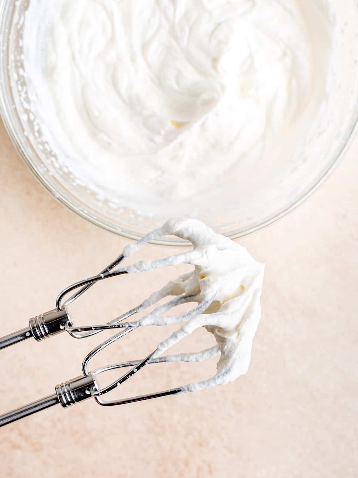 Cold heavy whipping cream whisked to stiff peaks with a hand mixer.