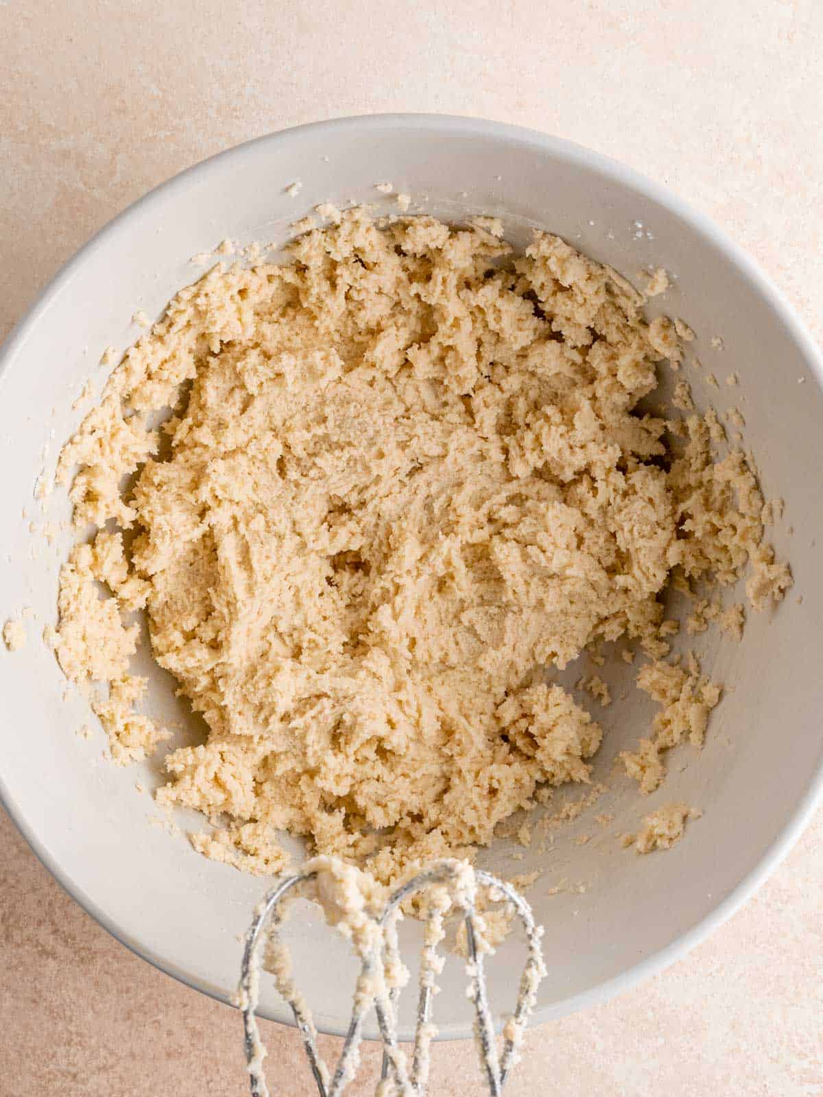 Almond flavored cookie dough in a bowl.