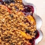 Blueberry and peach crisp in a pie dish.