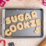 Soft cut out sugar cookies on a baking sheet.