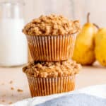 A stack of honey pear muffins with cinnamon streusel.