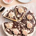 A no bake peppermint cheesecake swirled with chocolate and cut into slices.