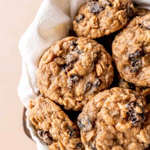 Oatmeal raisin cookies in a basket.
