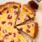 A pear and raspberry buttermilk tart with Biscoff cookie crust.