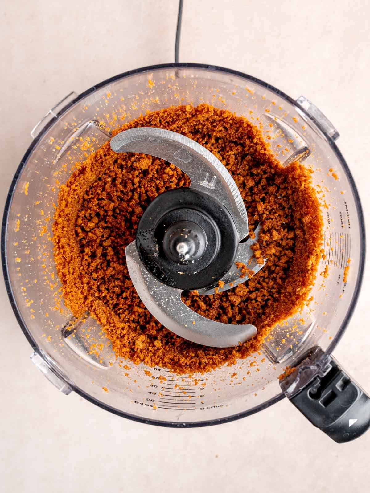 Biscoff cookies, sugar, and melted butter chopped in a food processor.