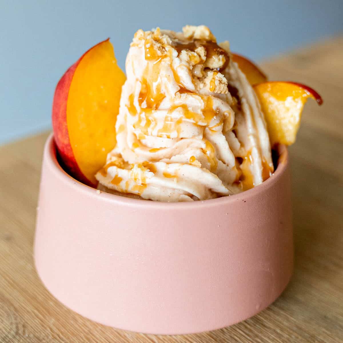 Peaches and cream soft serve ice cream with Golden Oreos and caramel sauce.