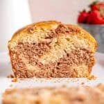 A loaf cake with vanilla and strawberry swirls.