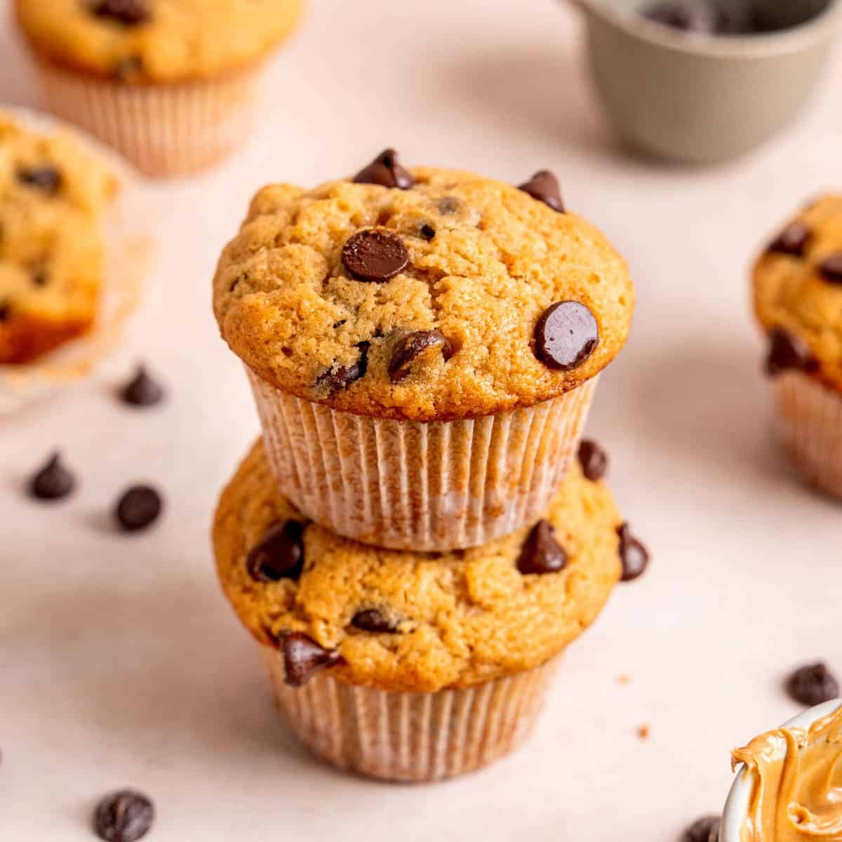 Chocolatey Peanut Butter Muffins 11 A stack of chocolate chip peanut butter muffins.