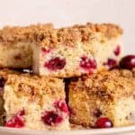 Slices of cranberry coffee cake on a platter.