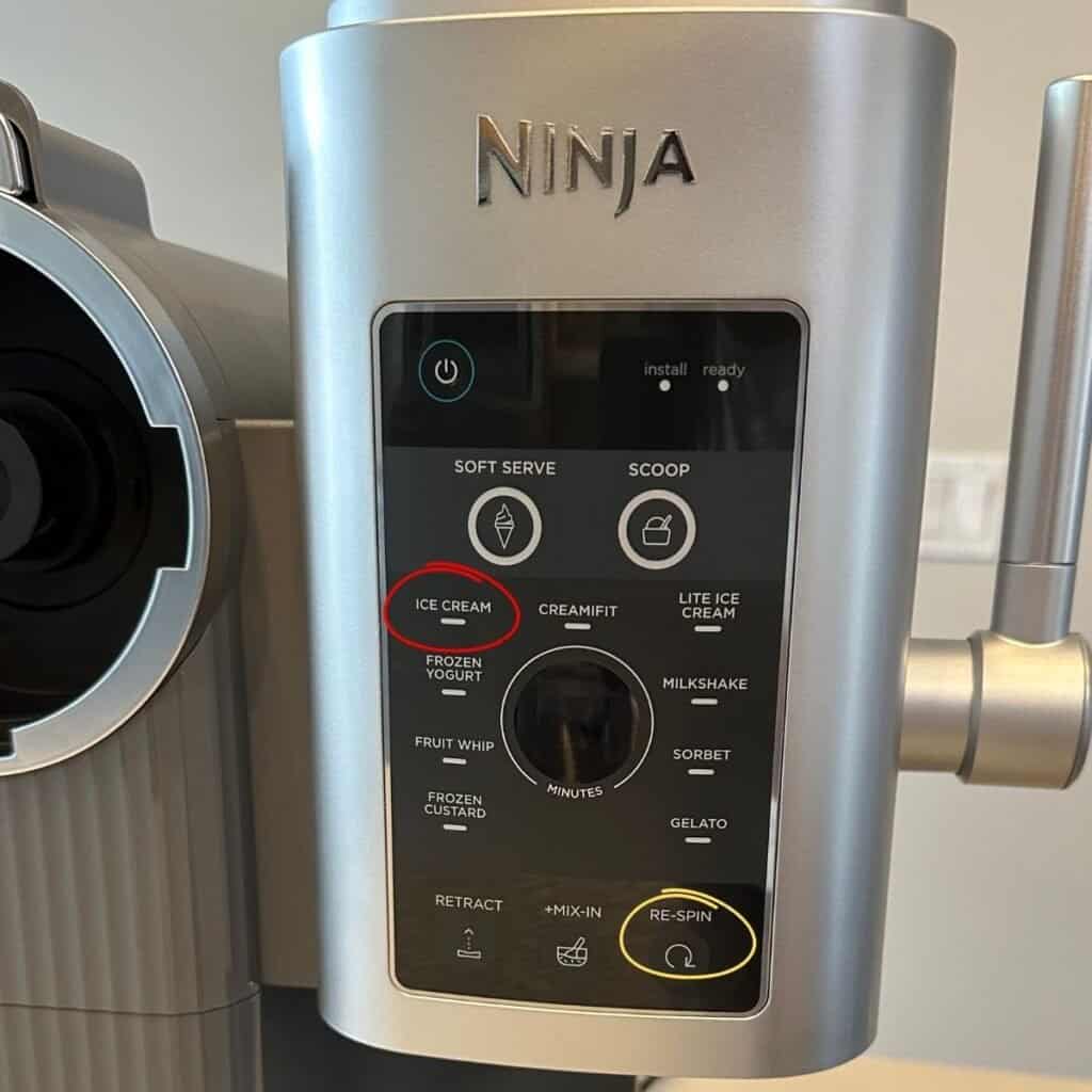 A Ninja Creami ice cream maker with the Ice Cream and Re-Spin settings circled.
