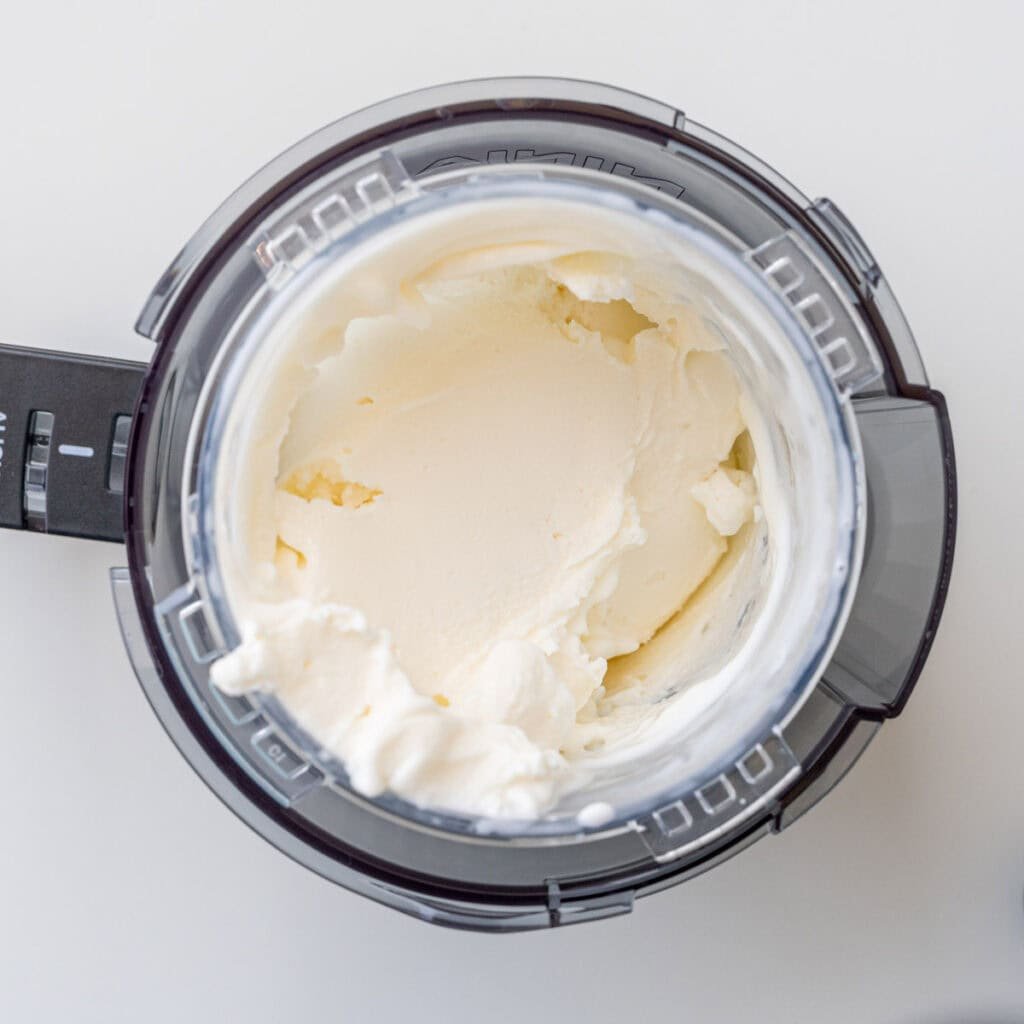 Lemon cheesecake ice cream in a Ninja Creami pint.