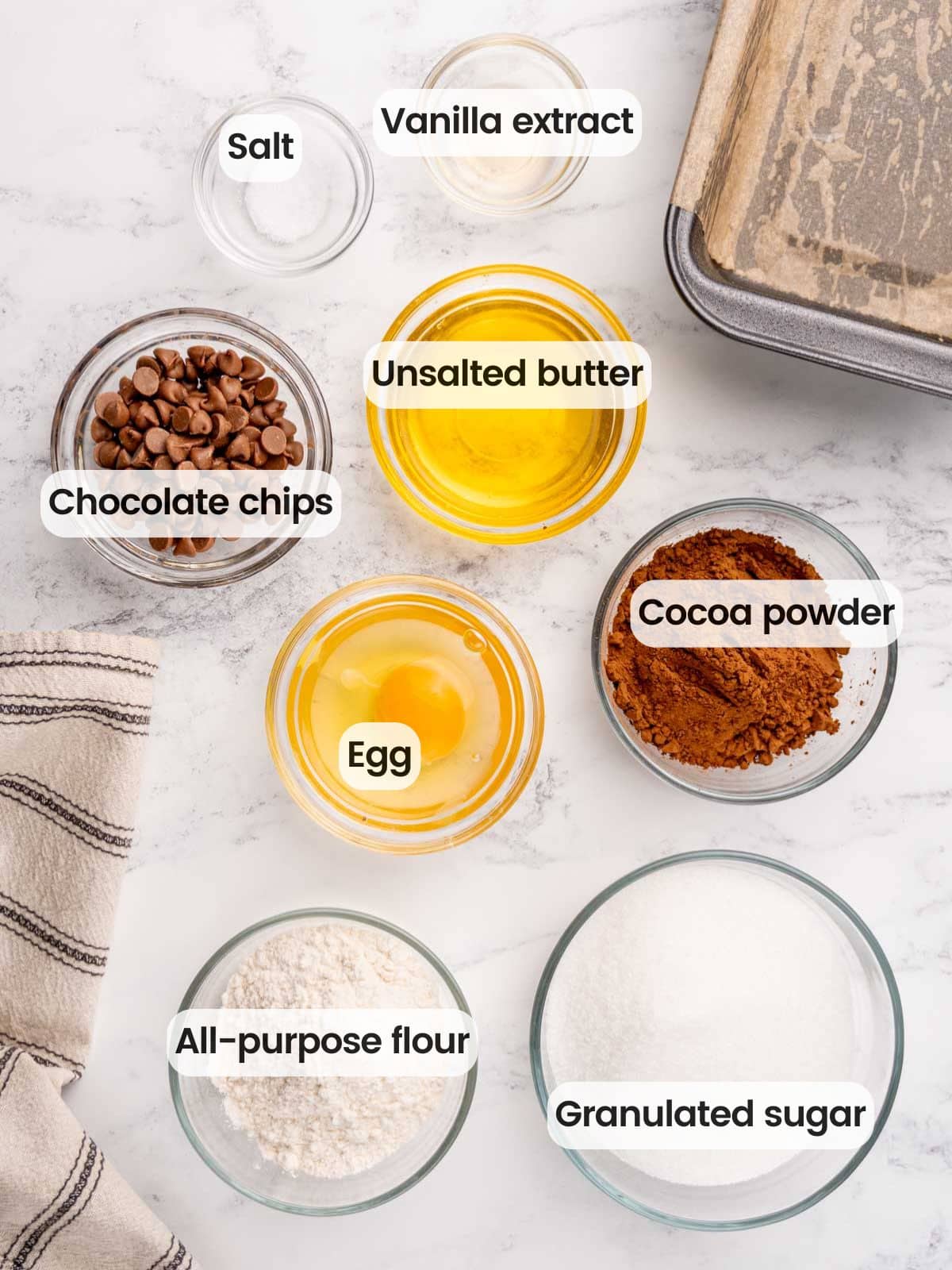 Ingredients needed to make small batch brownies in a loaf pan.
