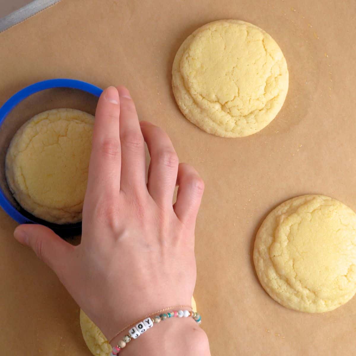 Scooting baked sugar cookies with lemon fresh out of the oven.