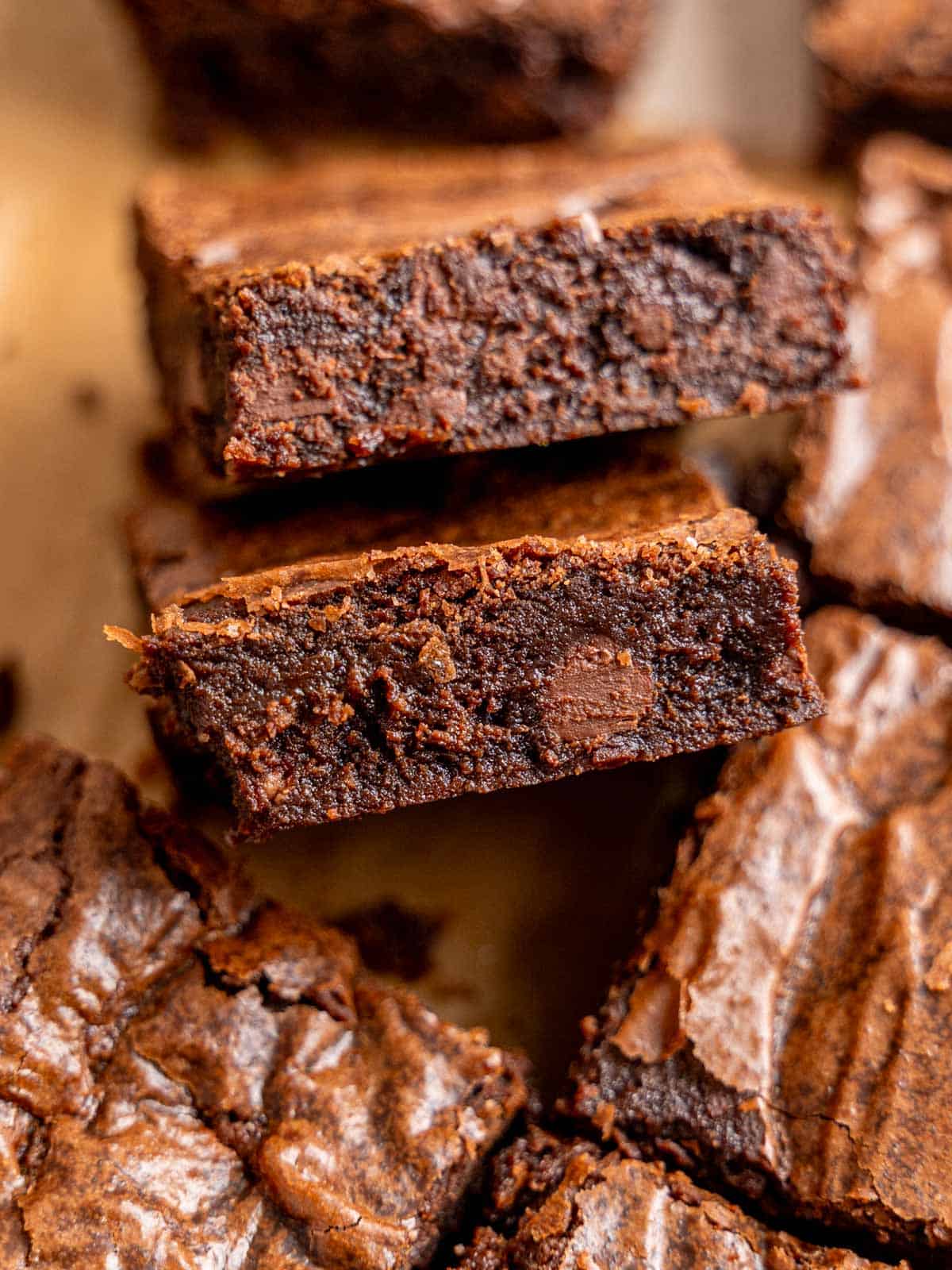 Slices of fudgy small batch brownies with chocolate chips and crinkly tops.