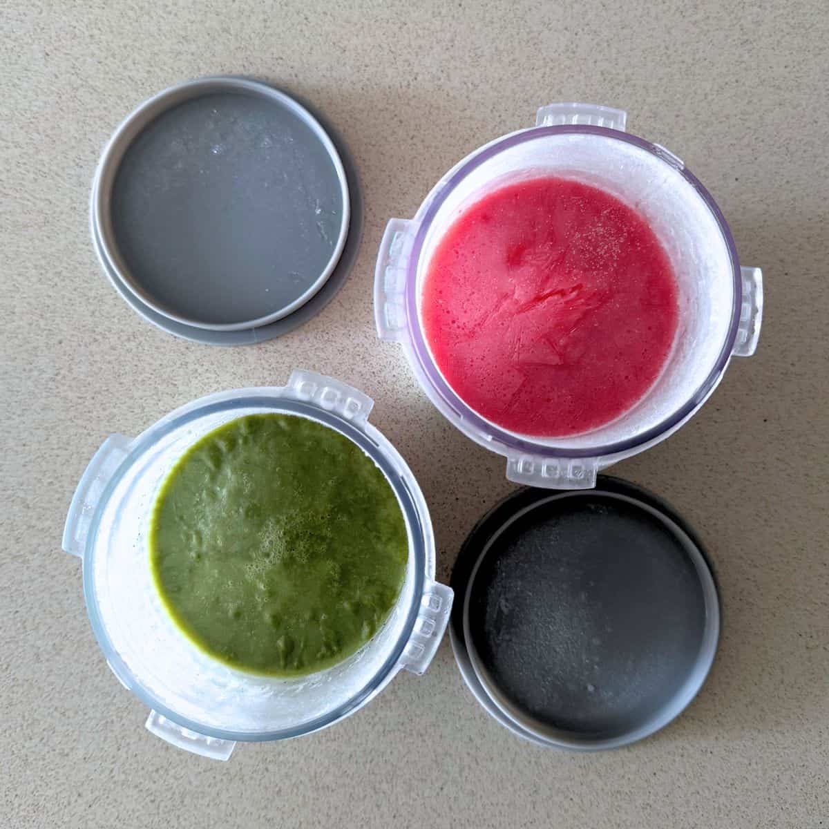 Matcha and strawberry ice cream mixtures frozen in Ninja Creami pints.