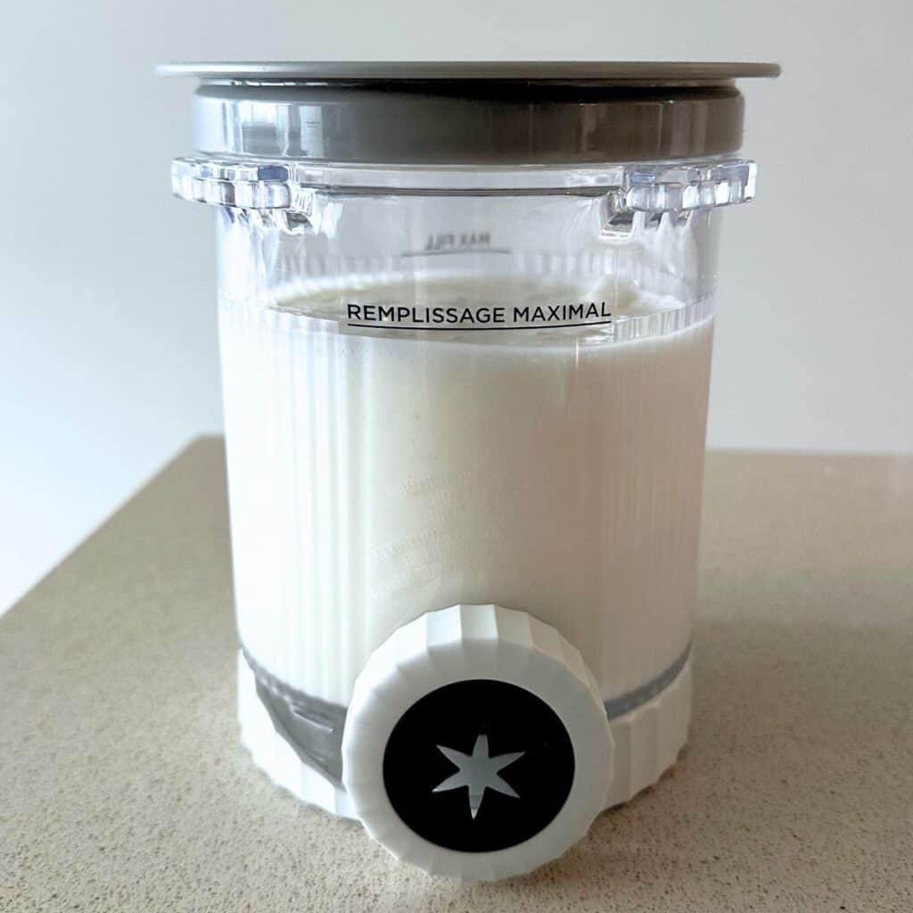 Cheesecake ice cream base in a Ninja Creami pint.