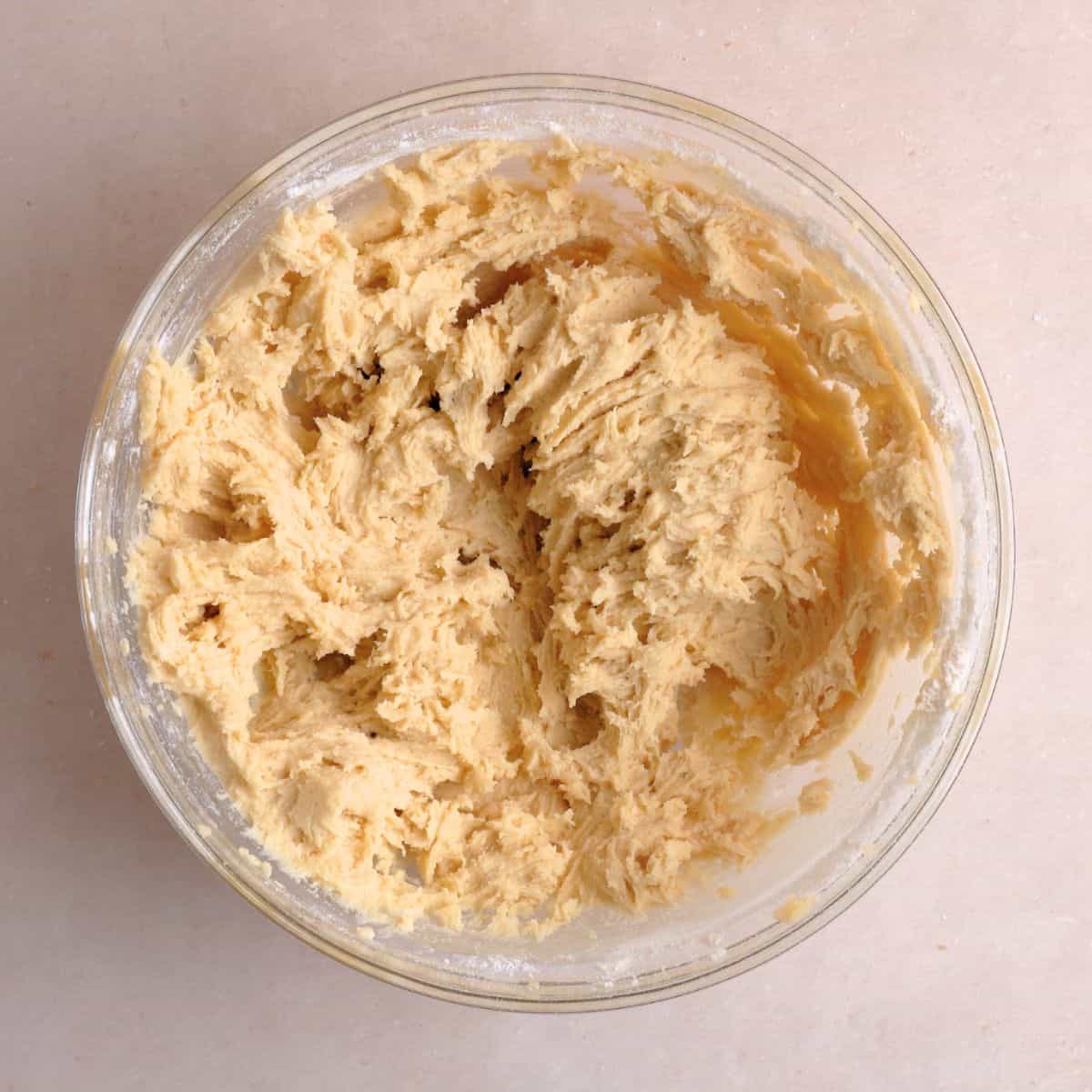 Plain cookie dough mixed in a bowl.