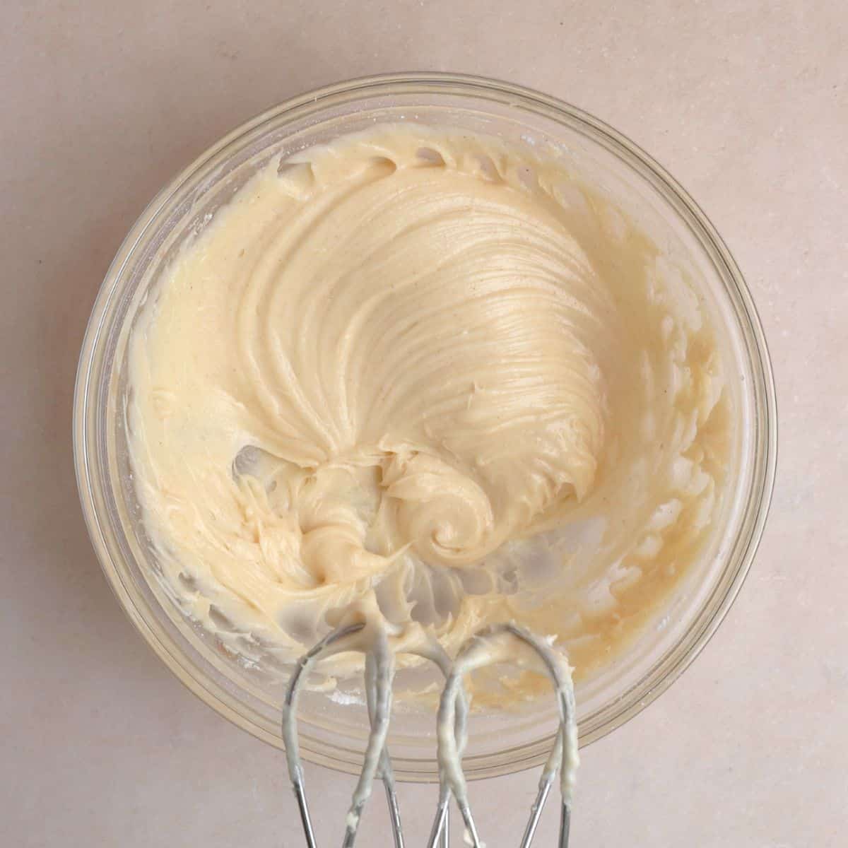 Cream cheese mixed together with cooled brown butter, vanilla extract, and powdered sugar to create frosting. 