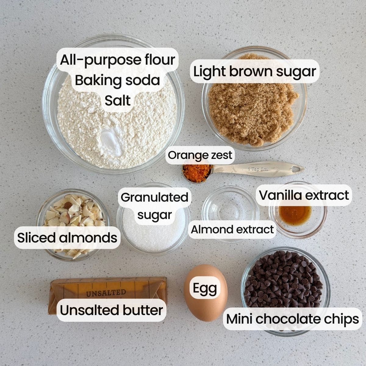Ingredients needed to make orange almond chocolate chip cookies.