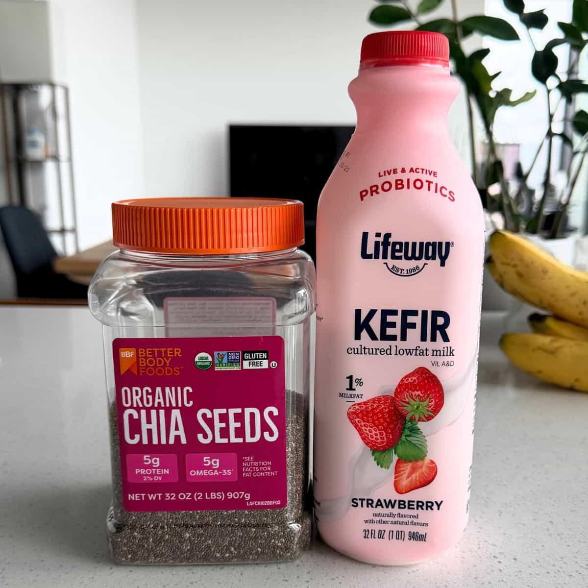 Chia seeds and strawberry kefir, the two ingredients needed to make high fiber and high protein chia pudding.